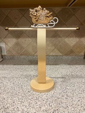 Decorative metal towel stand featuring Santa On A Sleigh
